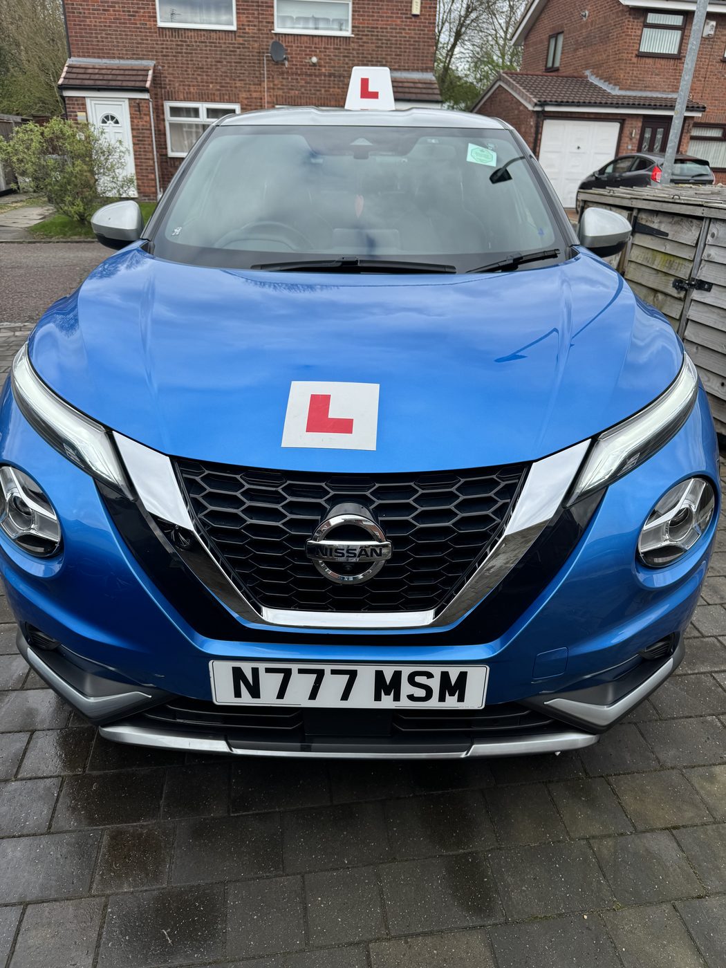 The front of the blue Nissan Juke, registration N777 MSM, with an L plate on the bonnet